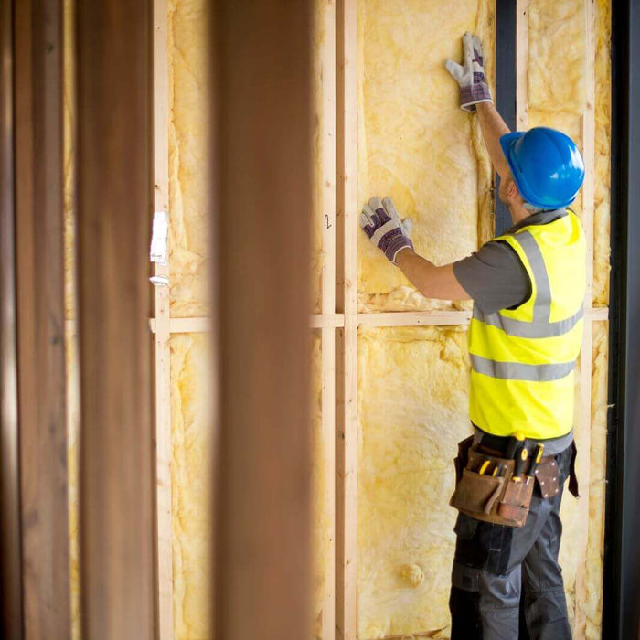 WADE BUILDING SUPPLIES | WORKER INSTALLING CAVITY WALL INSULATION