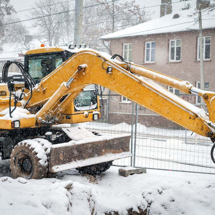 WADE BUILDING SUPPLIES | SNOW COVERED MACHINERY ON A BUILDING SITE