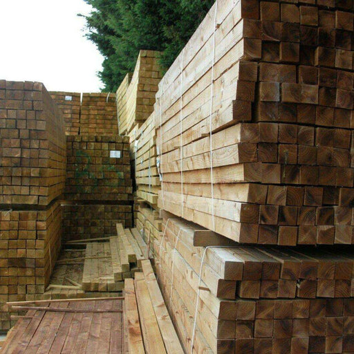 Pressure treated value packs from Wade Building Supplies. Picture of square wooden garden fence posts stacked at our depot